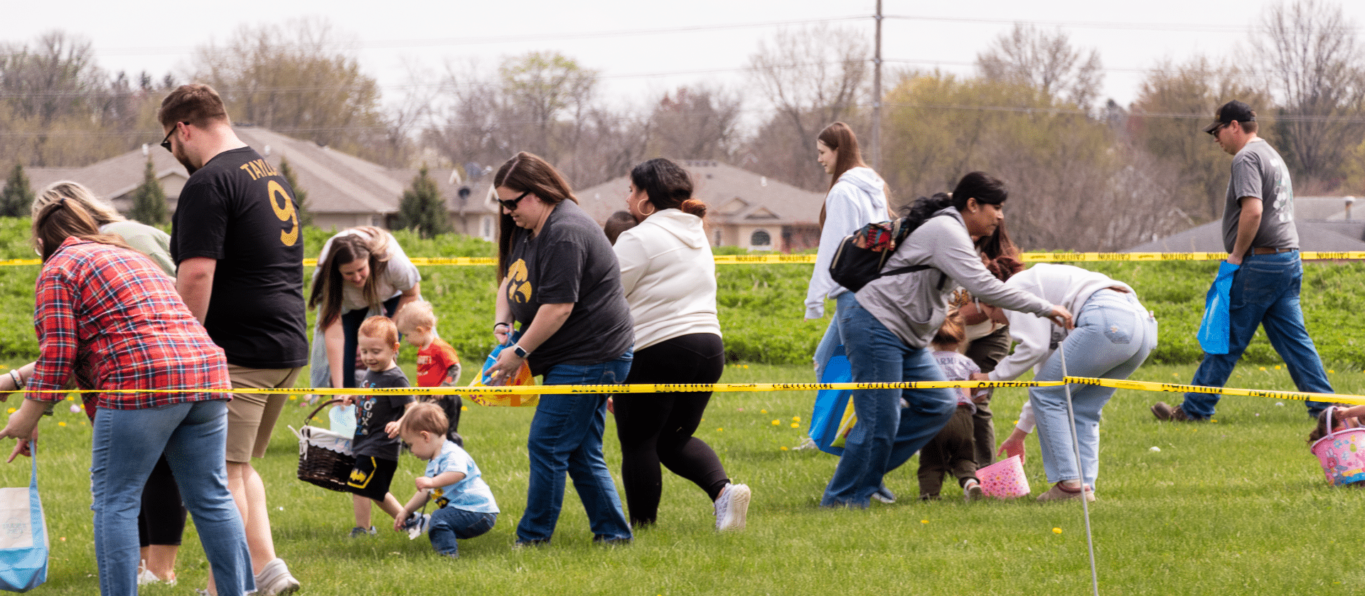 Families and kids joyfully hunt for eggs together in our welcoming church yard, surrounded by hope and laughter. - Muscatine Church of Christ