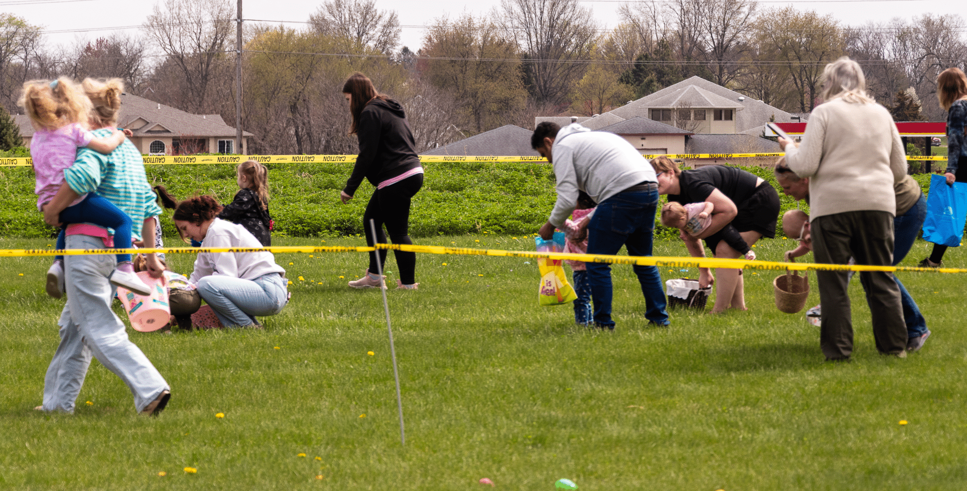 A joyful egg hunt brings together people of all ages on a sunny lawn—celebrating hope, community, and welcome. - Muscatine Church of Christ