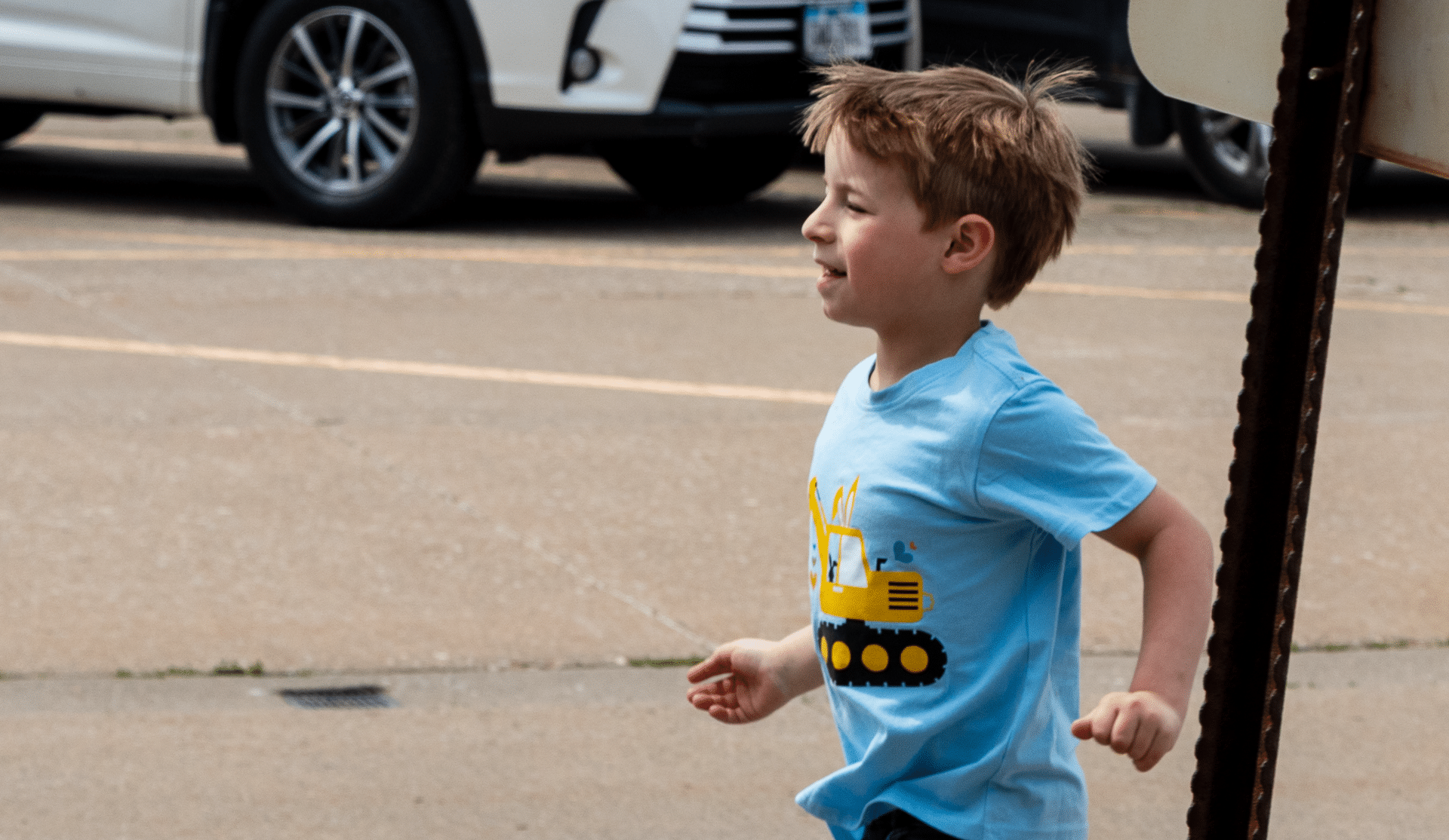 A joyful boy runs in the sunshine, reminding us of hope, laughter, and community at Muscatine Church of Christ. - Muscatine Church of Christ