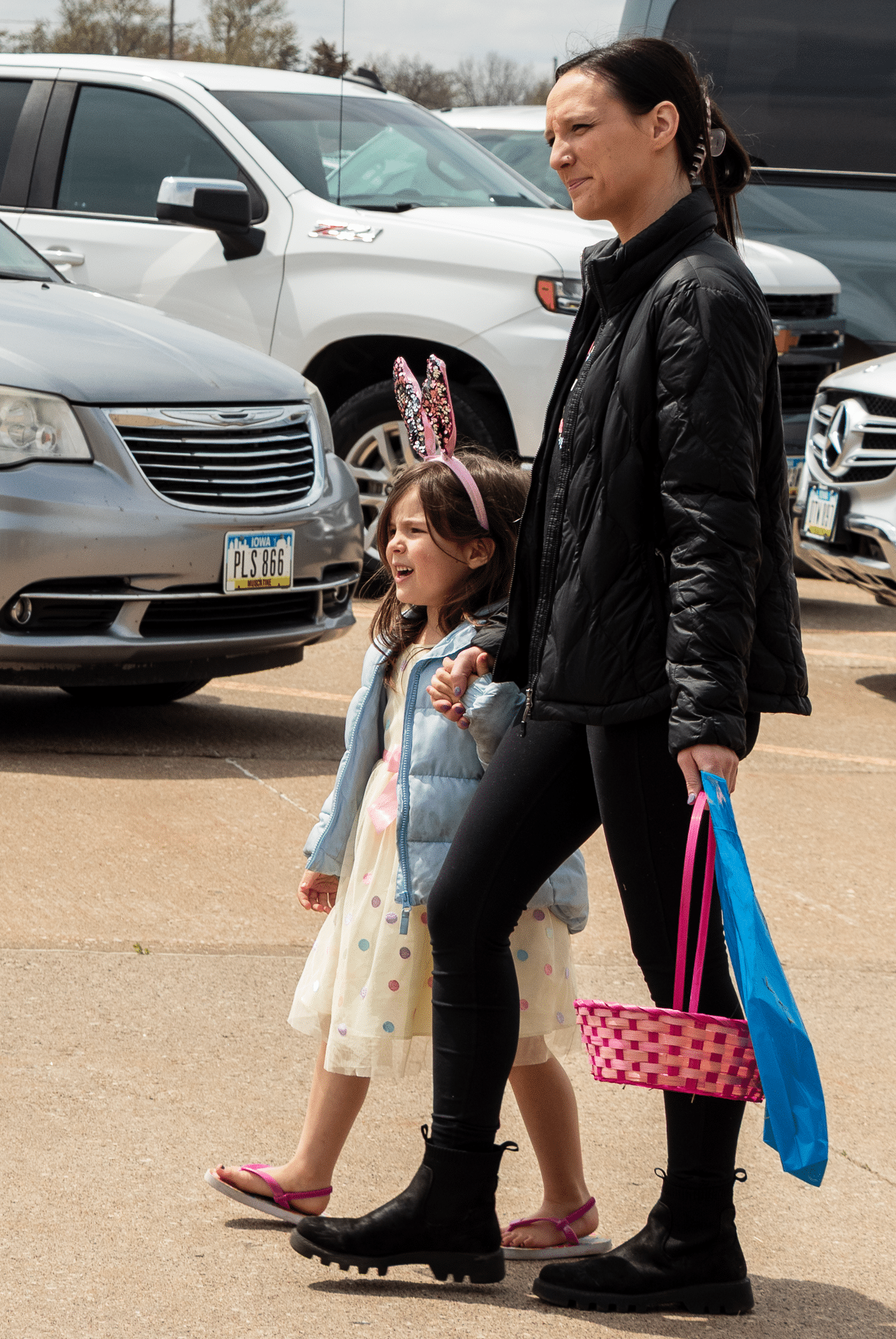 An adult and child share smiles in our lot—ready for joy, hope, and community at Muscatine Church of Christ. - Muscatine Church of Christ